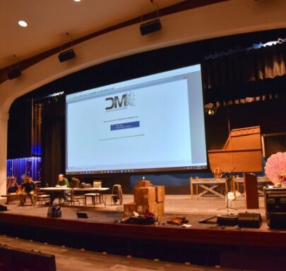 On stage screen at Newfield HS