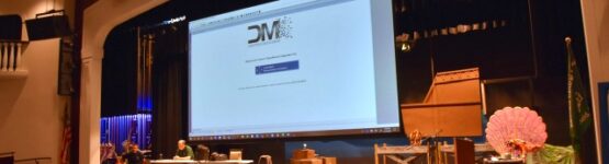 On stage screen at Newfield HS