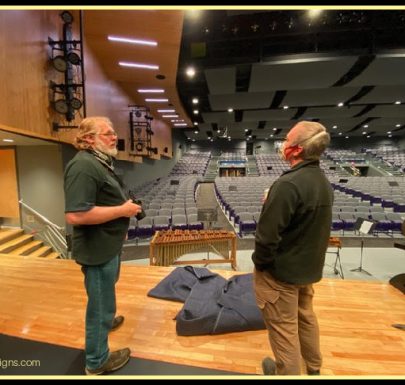 Stan on stage evaluating rigging